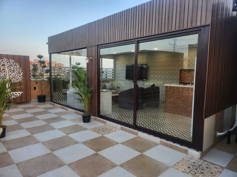 AC gazebo exterior on a landscaped Delhi terrace