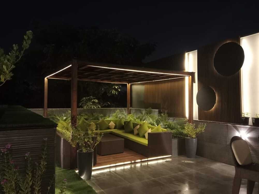 Pergola structure defining an outdoor seating room