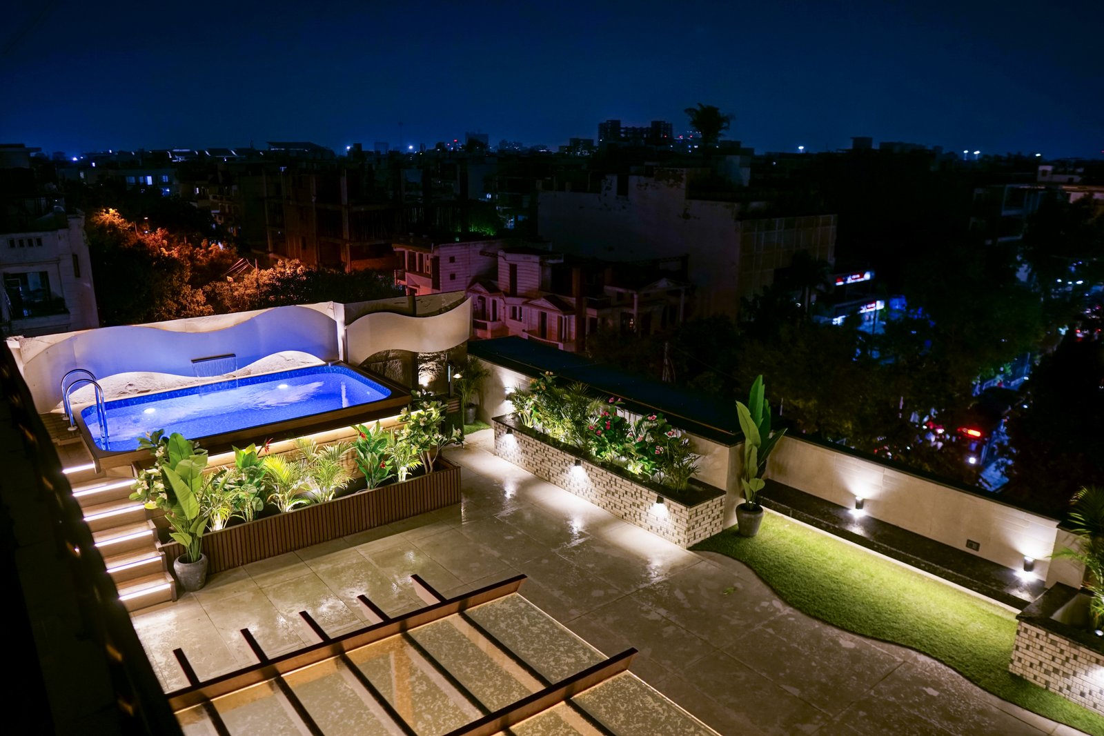 Punjabi Bagh rooftop — floating staircase with illuminated steps