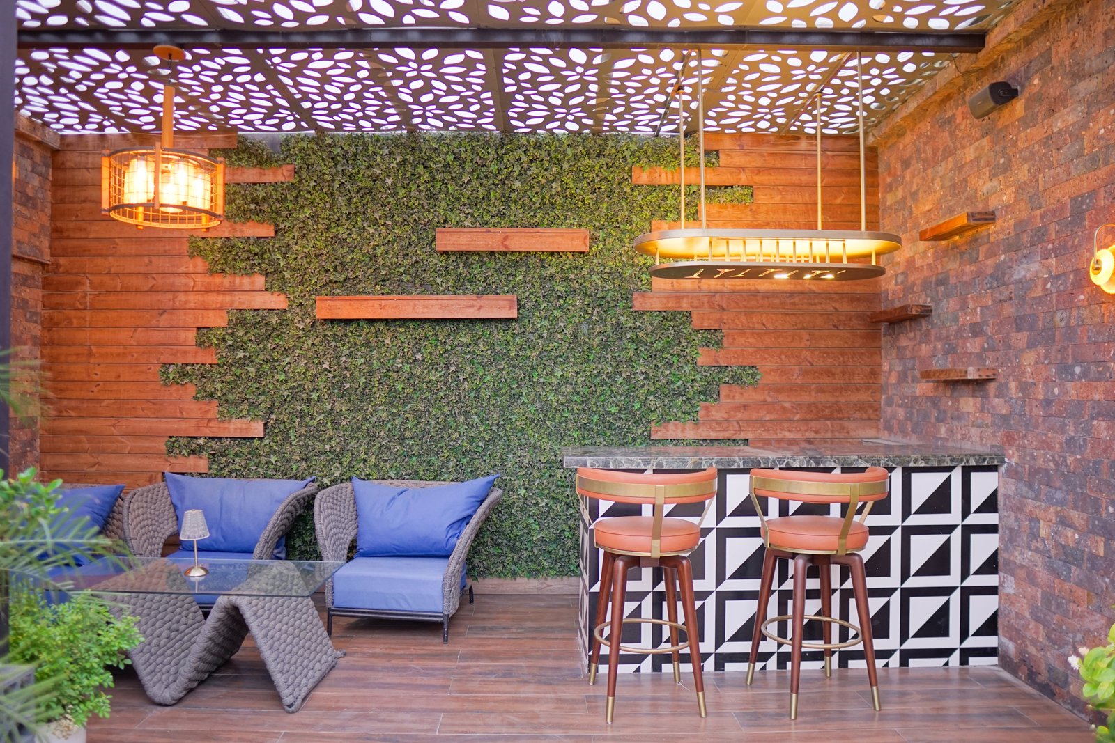 Rajouri Garden terrace — boutique steel pergola with shadow-lace pattern