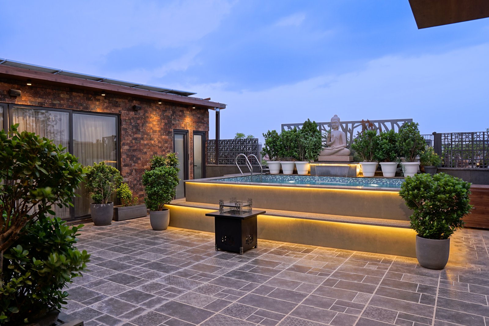 Rajouri Garden terrace — mosaic pool with concealed cove lighting